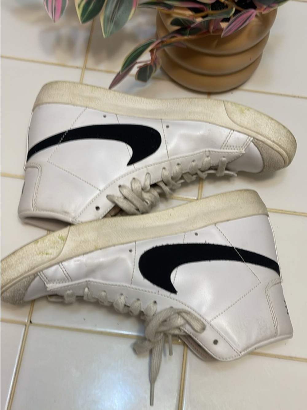 Nike White Sneaker with Orange Swoosh Accent